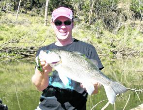 Fishing the Brisbane River is not only for anglers with boats. This bass was caught land-based.