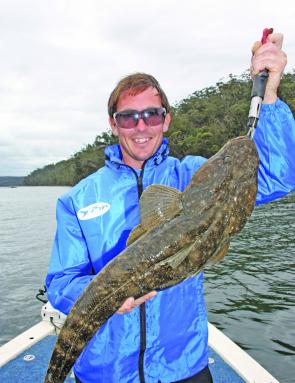 Stuie with a beaut 87cm dusky flathead prior to release. This fish was caught on the second-last cast of the day so the moral is never to give up!