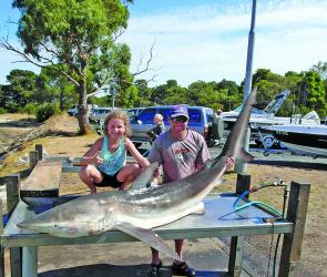 Gawaine Blake and daughter Asher display their big bronze whaler caught from Bass Strait. 