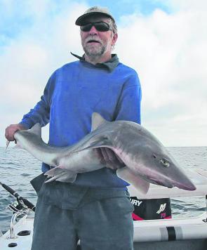 Peter Tennant holds up this thumping big gummy caught offshore Port Albert. It went close to 15kg.