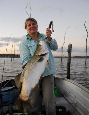 Denise Kampe looks pretty happy with her late August barra from Lake Monduran. 