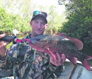 Matt Williams with one of many jacks he's caught and released this season.