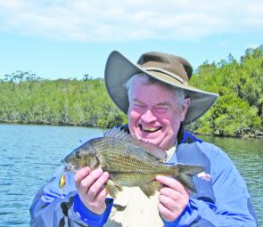 Robert Webley was understandably happy with a black bream caught on a black and gold crankbait.