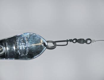 Spoon style lures spin constantly so you need a ball bearing swivel to avoid massive twist in the leader and also to allow the spoon to spin freely. I generally use a small 40lb ball-bearing snap swivel to conveniently attach my lures to the leader. My le