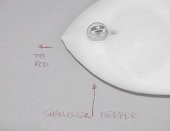 The trolling board has a lesser degree of variation in its trolling depth, but in general it will troll deeper than the paravane due to having a larger surface area and therefore more resistance in the water. However, you can alter the depth a bit by slid