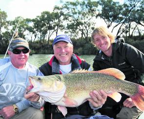 Rex Hunt holds a Murray cod caught while fishing the Murray River with the author and Czech Republic TV angler Jakub Vagner.