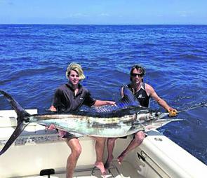 A striped marlin held by Benn Boulton and Nick Cowley from local charter boat Playstation just prior to release.