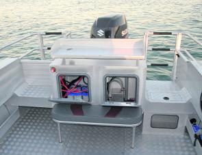 The McLay’s batteries are easily accessed, as is the fuel breather system, note also the lined side pockets, deck wash to port plus window equipped live well. 