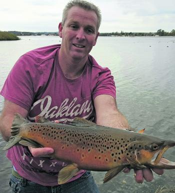 Ben Young with an awesome Lake Wendouree brown trout caught casting an Eccogear 3” Powershad Power Worm soft plastic.