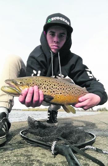 Nathan Angee with his PB trout at 60cm from Lake Wendouree caught casting soft plastics. 