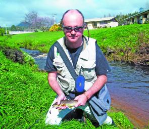 David Mercer with a good fish from the Penguin Creek. Small creeks and river are great fun, and catch and release fishing is recommended.