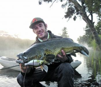 Ryan Thompson with an early morning cod on a swimbait.