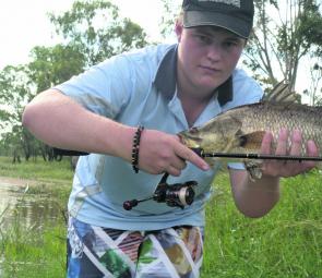 The author with a 60cm freshwater barra caught on a Sebile Splasher 52, 4Ib leader and 4Ib braid.