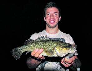 Joey Barca with a decent little Murray cod he caught casting a surface lure from the bank after sunset.