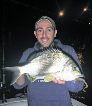 Paulie Romano with a solid 39cm Bream. Note the 9g jig head and Squidgy Wriggler tail, perfect for getting into the zone when the tide is pushing hard.