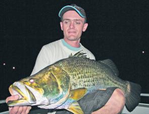 Vinnie with a typical run-off barra caught on a 120mm Koolabung Fizzer.