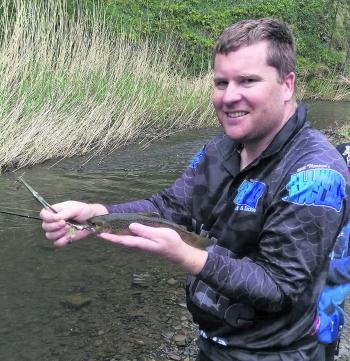Shane Wedrowicz with a healthy brown trout caught on Mapso Spinner.