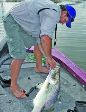 Kerry Ehrlich removes a solidly set Backbone Jig from the mouth of a Monduran barra.