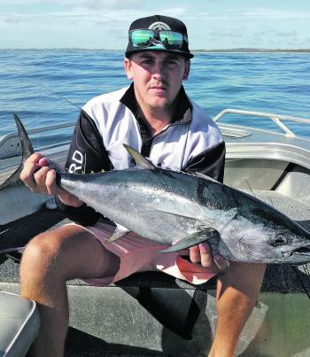 Ricky Thomas with a longtail tuna. When you’re chasing snapper you should always keep a rod rigged with a slug, because you never know when a tuna school might bust up in the vicinity.