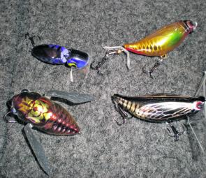 The author’s favourite surface lures, from left: Top, Nicel Lures Crickeye, Taylor Made Fat Banger; bottom Megabass Siglet, Taylor Made Basscada. 