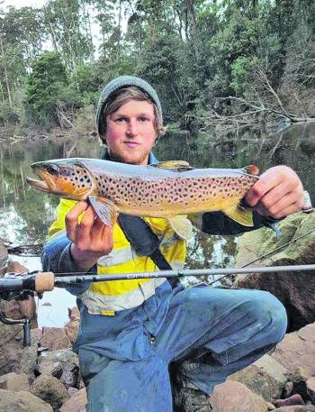 Part of the coastal crew firing up the trout fishing – Bryce Purton with a after work Lever River fish.