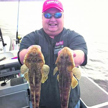 Adrian ‘Mozza’ Morrisby with a couple of very tasty looking flathead.