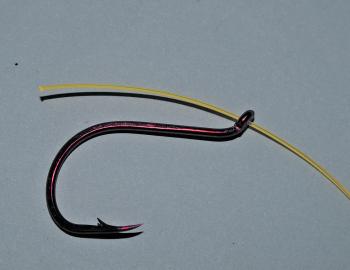To attach the bottom hook to the leader, use a snell, as this places virtually no stress on the leader. If you use a blood knot then ensure you lubricate the knot and pull it tight slowly to eliminate stress and friction on the leader. Additionally, this 