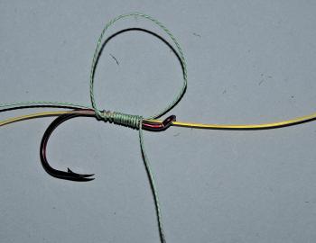Continue wrapping until you have between ten and fifteen wraps of the braid on the hook shank, leader and tag of braid.