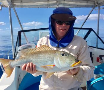 Yellowlip emperors are a relatively rare catch off Cairns. Note the Arafat style hat, which is ideal for hot conditions, especially when wet down regularly. 