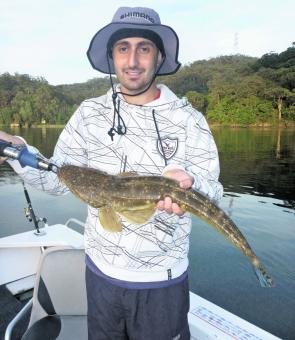 Hashim scored this 64cm flathead on a recent charter, the first of a 40-plus-fish session which also included jewies, bream, bass and estuary perch.