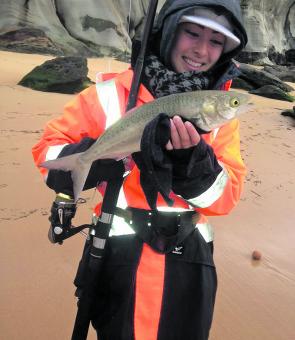 Anne Peron is a happy camper after catching this beach salmon.