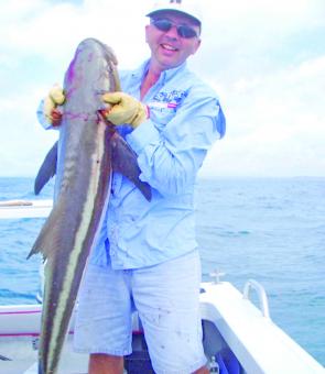 Paul from Keppel Bay Sport Fishing Club with his first cobia caught at the pinnacles.