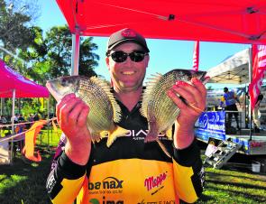 Grant Kime displays 2 of his 10 fish that helped him finish in second place overall.