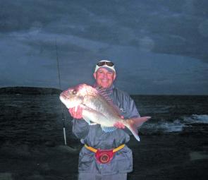Ray Smith with a solid south coast snapper off the rocks. Many hours were put in for Ray to taste success.