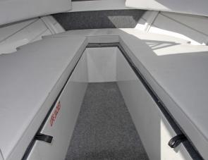 Bunks 2m long offer a handy place to stretch out or shelter from weather. Storage is plentiful above and below them. 