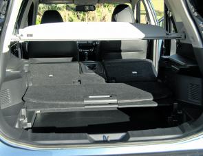 The Nissan’s rear cargo storage area has several layers of trays for storage of delicate or easily damaged items. Note the handy cargo blind. 