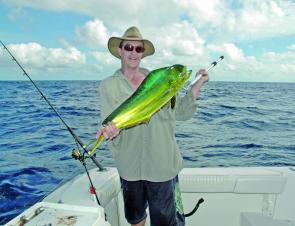 Chris with a typical small mahi mahi that have been around in numbers this season.