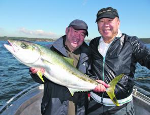 Famous chef Tetsuya Wakuda, left, and friend Ming with a great Harbour king.
