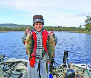 Curtis with two big redfin he caught at Lake Wartook casting soft plastics.