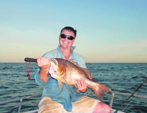 Aaron Goodchild from Brisbane Yamaha with his 81cm golden snapper caught at Sweers Island.