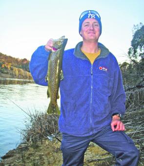 Craig Harvey with a decent brown trout caught at Curries River dam in Tasmania using Powerbait.