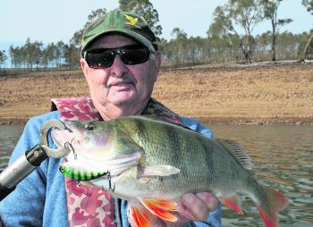 Kelvin Miles displays a quality 43cm redfin that was caught casting a Jackall lure at Lake Eppalock.