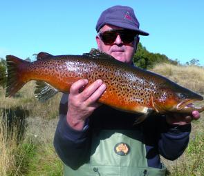 Neville Betts from Canberra a regular to Jindabyne with a great brown caught in the cool waters of winter.