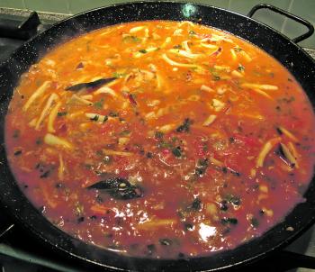 Add the saffron and paprika, then add hot fish stock. Mix well and keep mixing so rice doesn’t stick. Let it come to the boil and reduce heat a little (approx. 10-15 minutes).