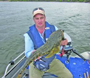 Craig Greenhalgh with a 78cm flathead caught on a soft plastic at Metung. 