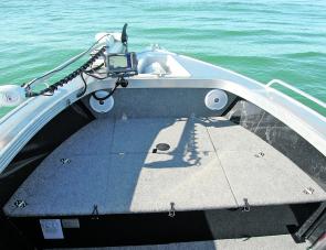 Ample work area up front of the Renegade is a feature anglers will enjoy. Note the neat Lowrance setup, plus the under-floor hatches. 