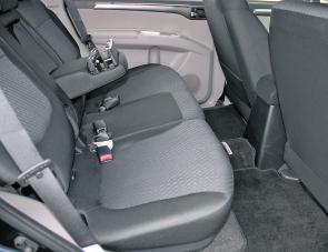 The Challenger’s rear seats can recline; note the paired drink holders on the arm rest.