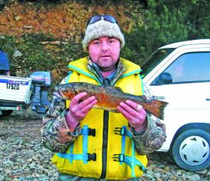 Adam Thomas of the Penguin Fisheries Club with a typical Burbury brown trout.