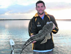 Abe Barret with a 75cm lizard taken from Pumicestone Passage. Notice the care and respect Abe is giving this big girl to ensure a safe release.