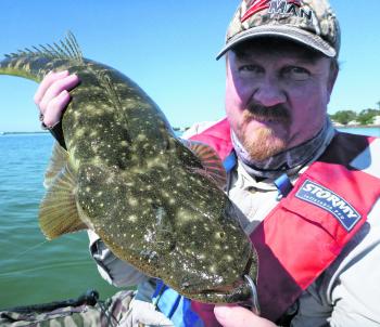 A falling tide, a blind gutter and a planned approach resulted in this quality flathead.